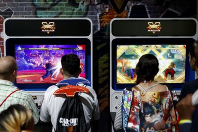Attendees play the Capcom Co. Street Fighter V: Arcade Edition video game during the E3 Electronic Entertainment Expo in Los Angeles, California, U.S., in Los Angeles, California, U.S., on Wednesday, June 13, 2018. For three days, leading-edge companies, groundbreaking new technologies and never-before-seen products are showcased at E3. Photographer: Patrick T. Fallon/Bloomberg