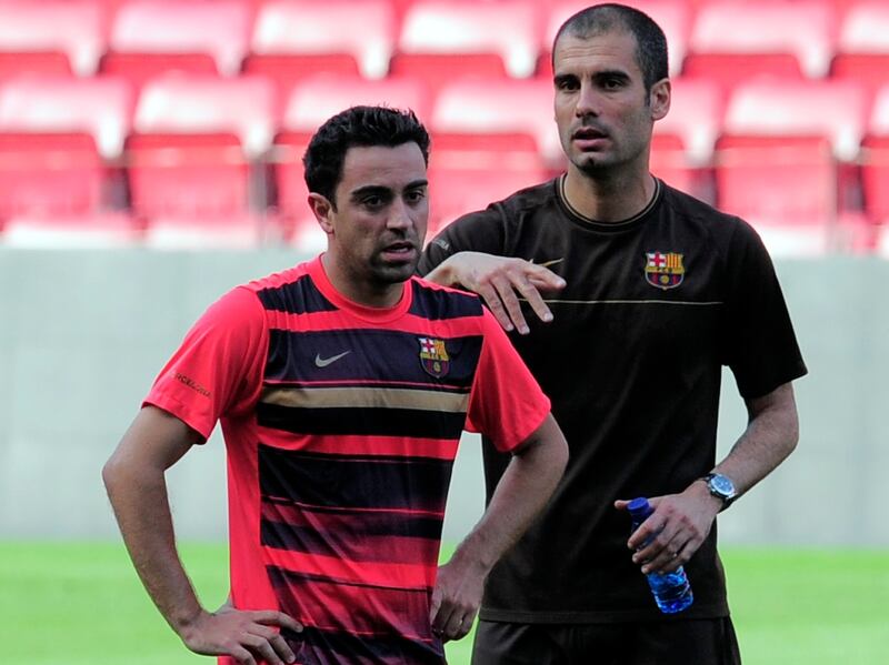 The then Barcelona manager Pep Guardiola, right, with Xavi Hernandez at Camp Nou in 2009. AP