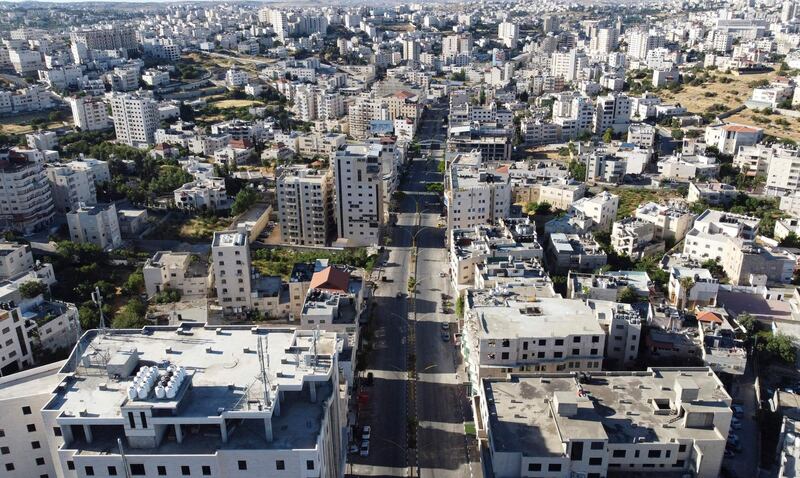 An aerial picture shows an empty main road in Hebron city. AFP