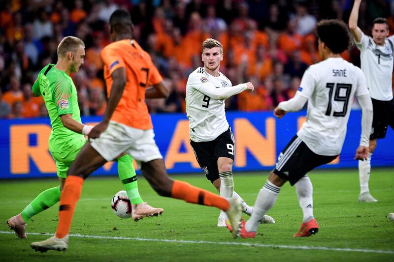 epa07091320 Germany's Timo Werner (C) in action during the UEFA Nations League, league A, group 1, soccer match between the Netherlands and Germany at Johan Cruijff ArenA in Amsterdam, Germany, 13 October 2018.  EPA/SASCHA STEINBACH DFB regulations prohibit any use of photographs as image sequences and/or quasi-video.