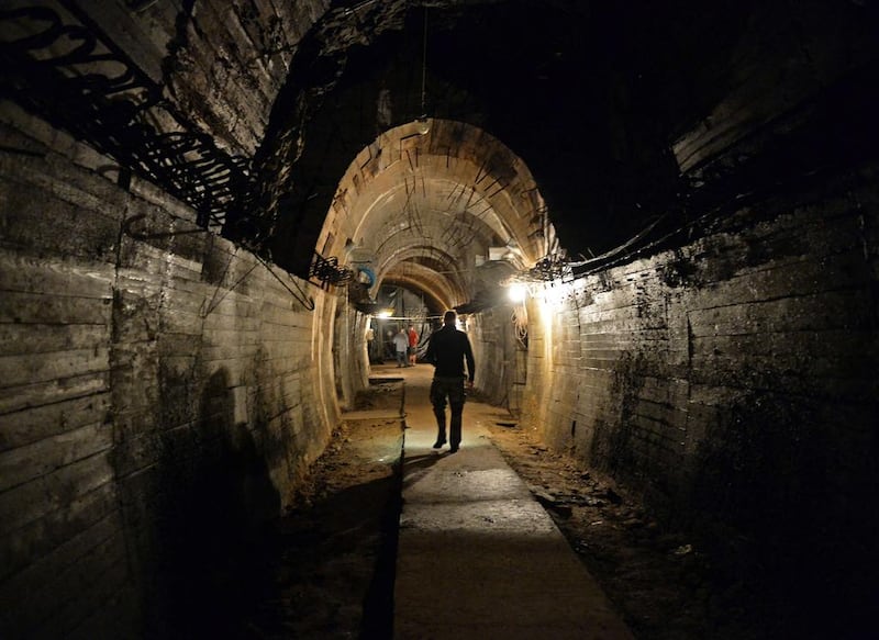 Men walking in the underground galleries, part of Nazi Germany “Riese” construction project under the Ksiaz castle in the area where the Nazi gold train is supposedly hidden underground, in Walbrzych, Poland. Janek Skarzynzki/ AFP Photo