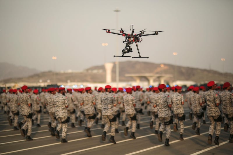 A drone is used to record a military parade by Saudi security forces in preparation for the annual Hajj pilgrimage in Mecca, Saudi Arabia, Thursday, Sept. 17, 2015. (AP Photo/Mosa'ab Elshamy)