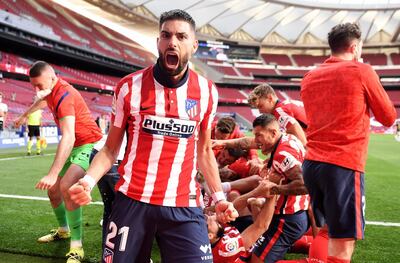 MADRID, SPAIN - MAY 16: Yannick Ferreira Carrasco of Atletico Madrid celebrates Atletico de Madrid's second goal scored by Luis Suarez (not pictured)  during the La Liga Santander match between Atletico de Madrid and C.A. Osasuna at Estadio Wanda Metropolitano on May 16, 2021 in Madrid, Spain. Sporting stadiums around Spain remain under strict restrictions due to the Coronavirus Pandemic as Government social distancing laws prohibit fans inside venues resulting in games being played behind closed doors.  (Photo by Denis Doyle/Getty Images) *** BESTPIX ***