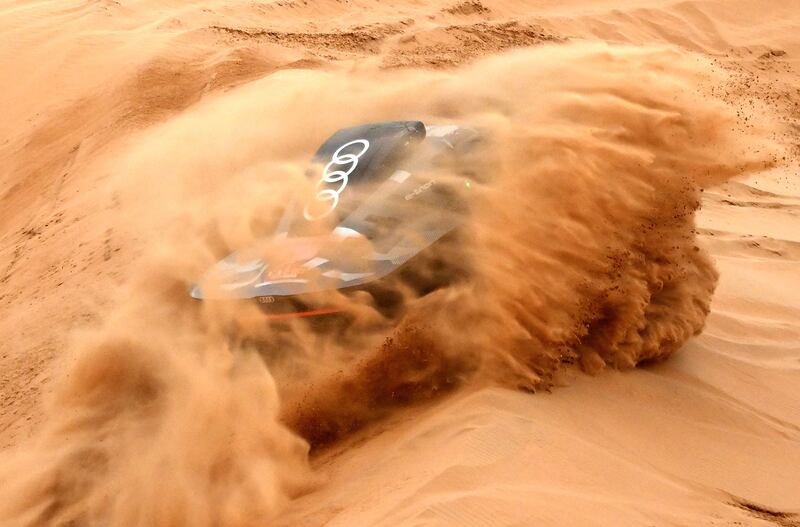 Audi's Spanish driver Carlos Sainz and Spanish co-driver Lucas Cruz compete during Stage 8 of the Dakar 2023 between Al Duwadimi and Riyadh, Saudi Arabia, on January 8, 2023.  (Photo by FRANCK FIFE  /  AFP)