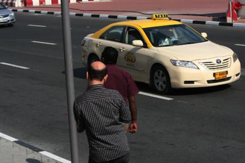 DUBAI - DECEMBER 28,2009 - Dubai taxi along Khalid bin Waleed road in Dubai. ( Paulo Vecina/The National )