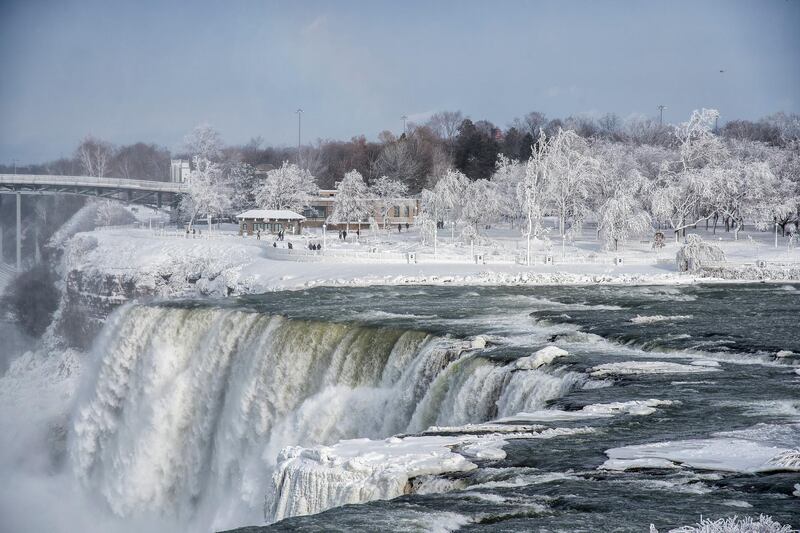 A frozen Niagara Falls seen from Stedman's Bluff on Goat Island of the American Falls.  James Neiss / The Niagara Gazette via AP
