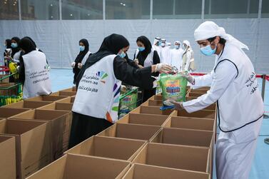 Volunteers pack donation boxes in Abu Dhabi as part of the 'From UAE and For Lebanon' initiative. Courtesy Emirates Foundation