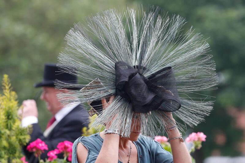 Taking things to extreme, this starched hair headpiece is a startling as it is memorable.  AP