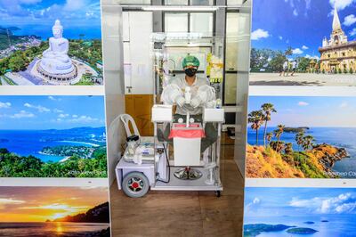 A medical assistant waits to test arriving passengers at Phuket International Airport. AFP