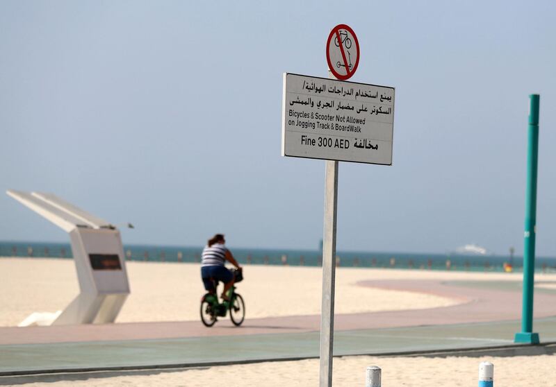 Signs on DubaiÕs KiteBeach warning people they will be fined if using a bike or a scooter on the jogging track on May 6th, 2021. Chris Whiteoak / The National. 
Reporter: Patrick Ryan for News