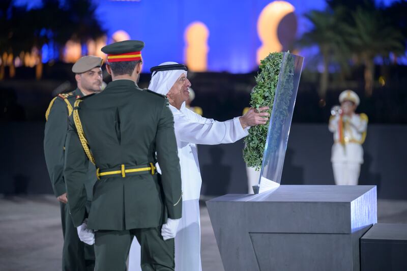 Sheikh Saud places a wreath during the Commemoration Day ceremony.
