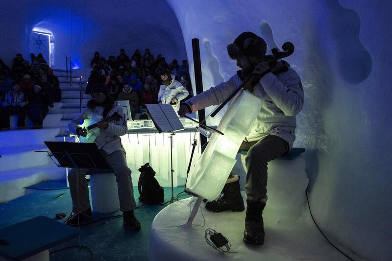 Musicians perform with the ice instruments. AFP