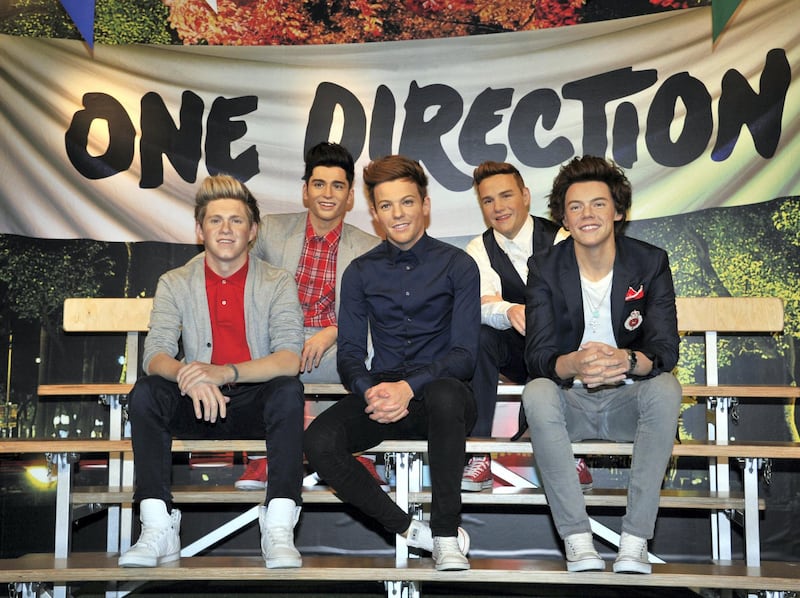 Wax figures of the members of English-Irish boy band 'One Direction' are displayed at the Madame Tussauds museum in Tokyo on February 11, 2014. The wax figures of the pop group will stay in Tokyo until May 12, 2014. AFP PHOTO / Yoshikazu TSUNO (Photo by YOSHIKAZU TSUNO / AFP)