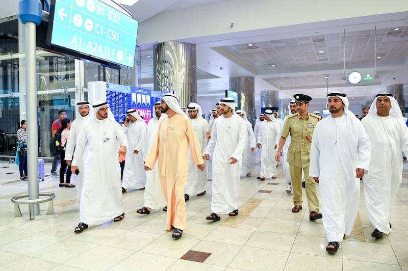 <p>Sheikh Mohammed, Sheikh Hamdan&nbsp;and Sheikh Maktoum, accompanied by Maj Gen Abdullah Al Marri, commander-in-chief of Dubai Police, walk through Dubai International Airport. Wam</p>
