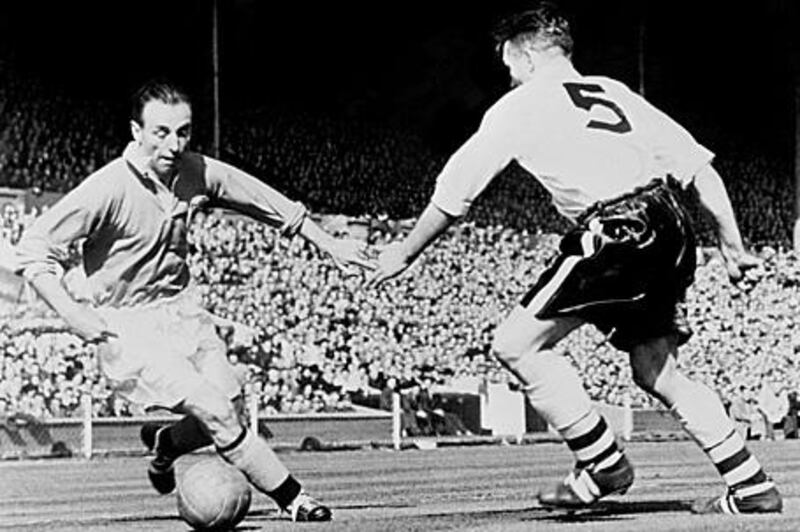 Stanley Matthews takes on Bolton's Malcolm Barrass during the 1953 FA Cup final which is know as the Matthews Final.