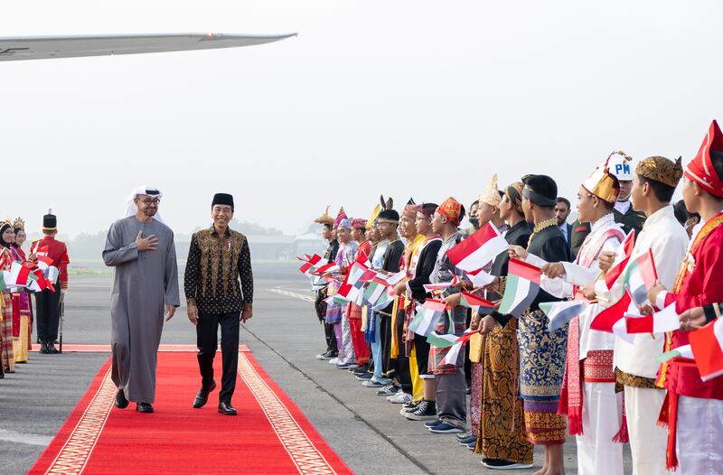 President Sheikh Mohamed is received by Indonesia's President Joko Widodo at Adi Soemarmo International Airport as he arrives for the G20 summit in Bali. All photos: UAE Presidential Court 