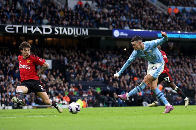 Phil Foden of Manchester City scores his team's first goal. Getty Images