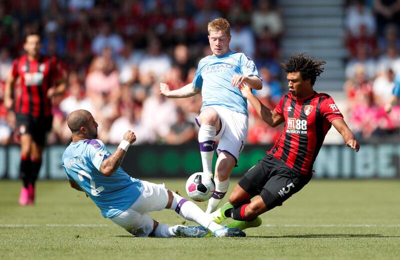 Bournemouth's Nathan Ake in action with Manchester City's Kyle Walker. Reuters