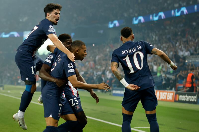 Kylian Mbappe celebrates with Vitinha and Neymar after scoring the first goal. EPA