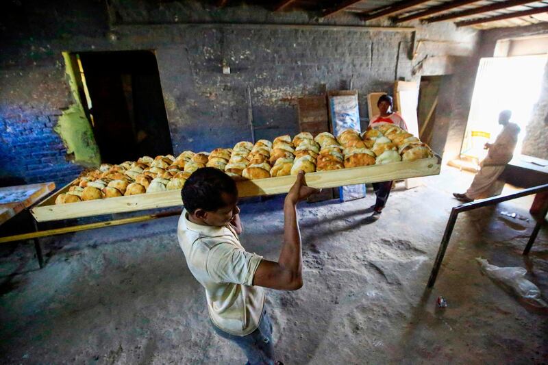 Sudanese bakers prepare bread at a bakery in the town of Atbara, an industrial town 350 kilometres northeast of Sudan’s capital Khartoum. AFP