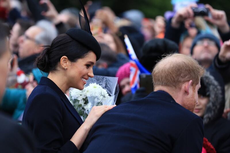 Meghan, Duchess of Sussex and Prince Harry, Duke of Sussex speak to well wishers after attending Christmas Day Church service at Church of St Mary Magdalene on the Sandringham estate in King's Lynn, England. Getty