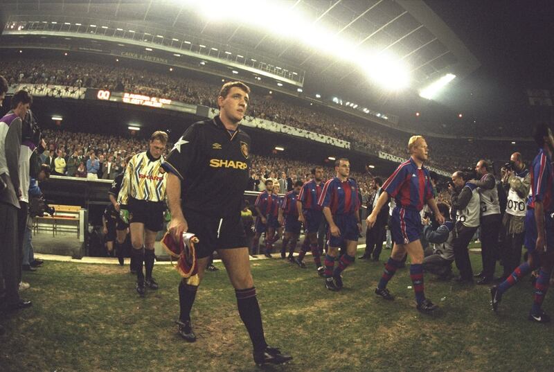 Steve Bruce leads Manchester United onto the pitch before the European Cup match against Barcelona at the Camp Nou Stadium in Barcelona, Spain, 1994. Barcelona won the match 4-0. Getty Images