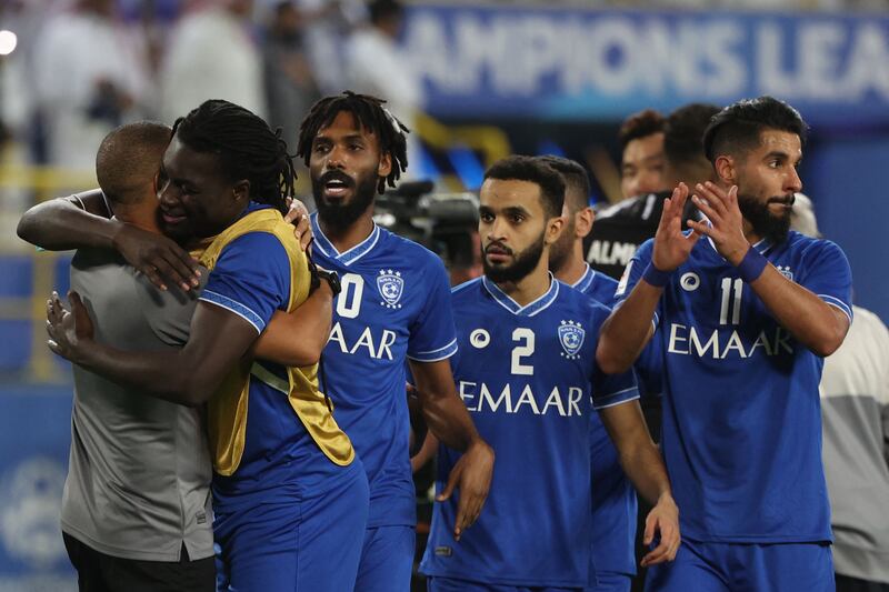 Hilal's players celebrate their win in the AFC Champions League semifinal football match between KSA's Al-Nassr and KSA's Al-Hilal on October 19, 2021, at the Mrsool Park Stadium in Riyadh.  (Photo by Fayez Nureldine  /  AFP)