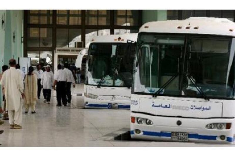 The Abu Dhabi bus terminal, with its new blue-and-white air-conditioned buses, is a gateway to many parts of the UAE. Andrew Parsons / The National