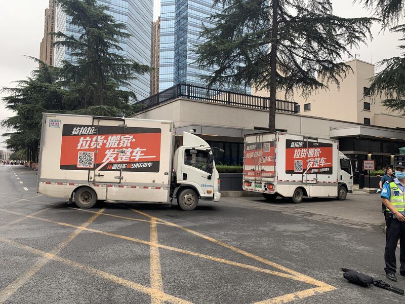 Moving trucks arrive at the US Consulate General Chengdu. Bloomberg