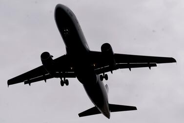 A plane arrives at Salt Lake City International Airport. Many passenger flights, which deliver about half of all air cargo, remain grounded. AP