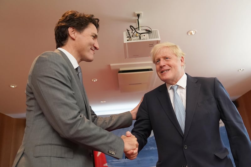Mr Johnson meets Mr Trudeau. PA