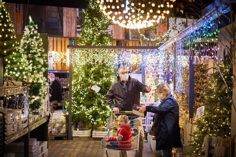 Dutch shoppers browse Christmas trees. Announcing an extension of restrictions in the Netherlands, Mr Rutte acknowledged it was “not the glad tidings you hope for at Christmas time”. AFP