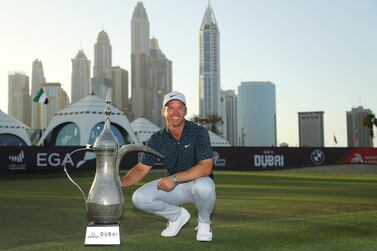 DUBAI, UNITED ARAB EMIRATES - JANUARY 31: Paul Casey of England celebrates with the winners trophy after the final round of the Omega Dubai Desert Classic at Emirates Golf Club on January 31, 2021 in Dubai, United Arab Emirates. (Photo by Warren Little/Getty Images)