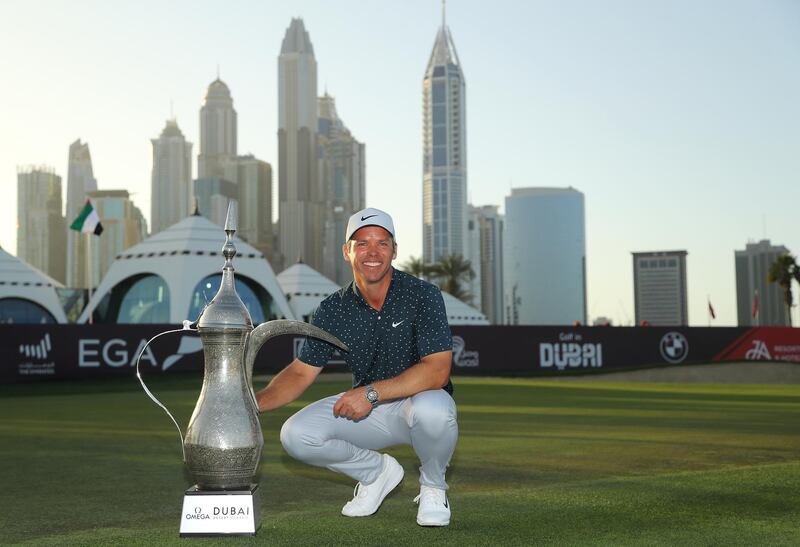 DUBAI, UNITED ARAB EMIRATES - JANUARY 31: Paul Casey of England celebrates with the winners trophy after the final round of the Omega Dubai Desert Classic at Emirates Golf Club on January 31, 2021 in Dubai, United Arab Emirates. (Photo by Warren Little/Getty Images)