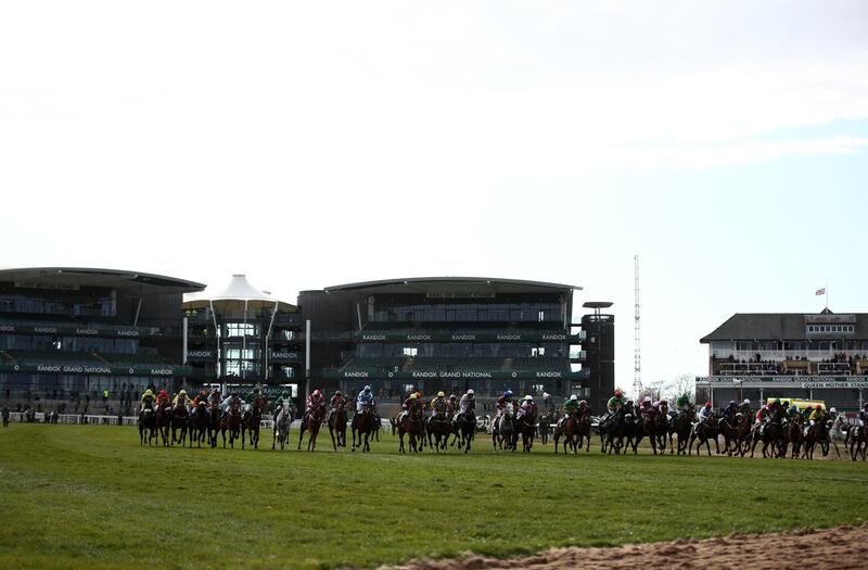 Riders at the start of the Grand National at Aintree Racecourse. Getty