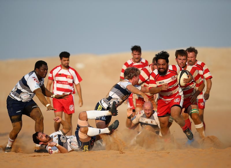 RAS AL KHAIMAH, UNITED ARAB EMIRATES - OCTOBER 21:  Solomon Masters of RAK Goats breaks away from Kane Monaau of Beaver Nomads during the Community League match between RAK Goats and Beaver Nomads at Bin Majid Beach Resort on October 21, 2016 in Ras Al Khaimah, United Arab Emirates.  (Photo by Francois Nel/Getty Images)