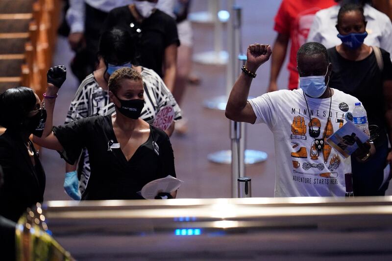 Mourners pass by the casket of George Floyd during a memorial for Floyd at the Fountain of Praise church, in Houston, Texas. EPA