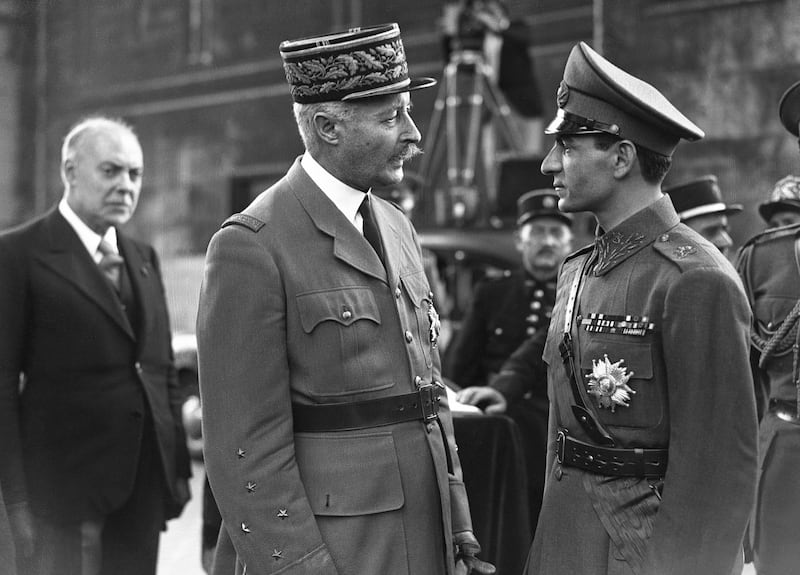 The Shah speaks with Gen Henri Giraud in front of the tomb of the Unknown Soldier in Paris, in August 1948. Getty Images