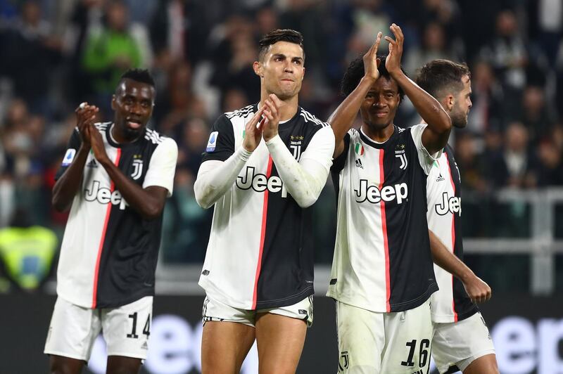 Cristiano Ronaldo and Juan Cuadrado of Juventus salute the crowd at the end of the Serie A match between Juventus and Bologna FC at Allianz Stadium in Turin, Italy. Getty Images