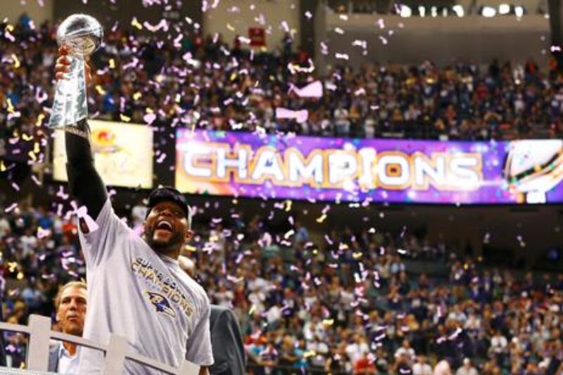 Baltimore linebacker Ray Lewis celebrates with the Vince Lombardi trophy after the Ravens' victory in the Super Bowl.