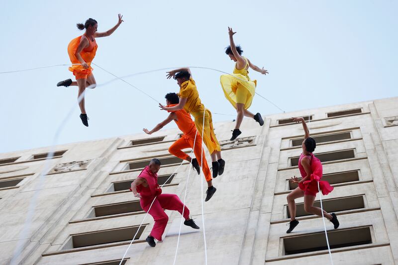 Members of the US dance company Bandaloop present the aerial dance piece 'Bird Strike', during the Santiago a Mil festival, in Santiago, Chile. EPA