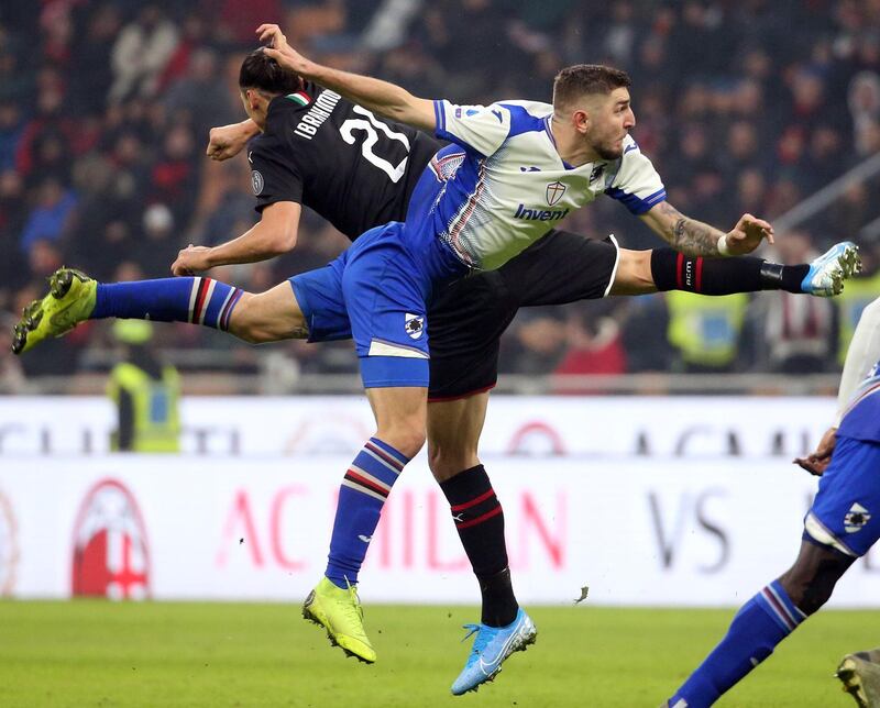 latan Ibrahimovic and Sampdoria's Julian Chabot battle for the ball. EPA