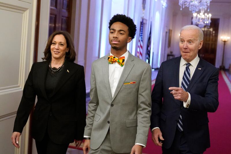President Joe Biden and Vice President Kamala Harris arrive with DuWayne Portis Jr, a youth leader at Chicago Youth Service Corps and a high school senior. AP
