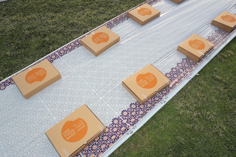 Boxes with biryani, laban, fruit and dates are placed for iftar  at Zabeel Park in Dubai. Pawan Singh / The National