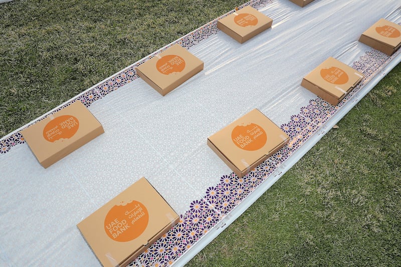 Boxes with biryani, laban, fruit and dates are placed for iftar  at Zabeel Park in Dubai. Pawan Singh / The National