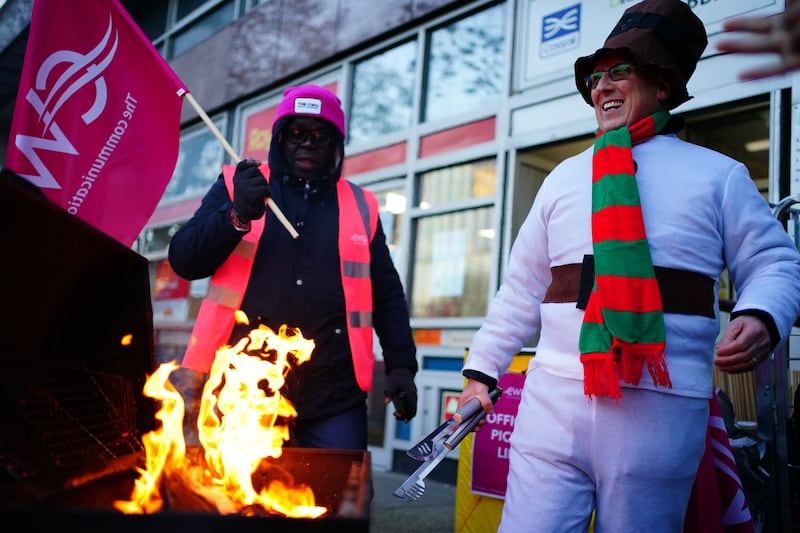 Members of the Communication Workers Union on the picket line in Whitechapel, East London, as Royal Mail workers  strike over jobs, pay and conditions. PA