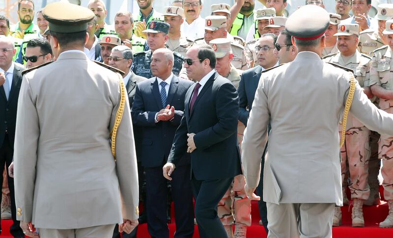 epa07572472 Egyptian President Abdel Fattah al-Sisi (C) attends the opening of the Rawd Al-Faraj bridge in Shobra district, Cairo, Egypt, 15 May l 2019. According to reports, Egypt requested to register the construction as the world's widest suspension bridge on the Guinness World Records. The length of the bridge is 720 meters and 14 meters above the level of the River Nile to facilitate the riverine movement. The suspension bridge is located within the third phase of the Rawd Al-Faraj axis, starts from Al-Khalafawi Square on the Corniche of the Nile in front of the Aghakhan Towers opposite the Nile on Al-Warraq Island passing through Bashteel area.  EPA/KHALED ELFIQI