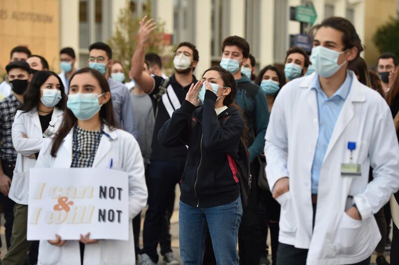 Medical students at the American University of Beirut (AUB) shout slogans during a protest against the adjustment of the dollar rate for new tuition fees in Beirut, Lebanon. EPA