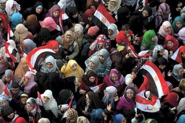 Women gather at Tahrir Square, Cairo, on February 18, 2011 during celebrations to mark one week since Egypt’s long-time president Hosni Mubarak was forced from office by mass protests. AFP