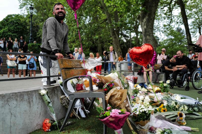 Flowers and balloons at the scene of the stabbing attack in Annecy, France, which left six people injured, including four toddlers. AFP